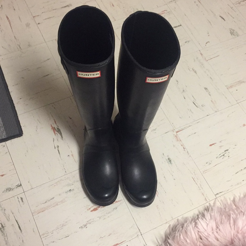 Black tall hunter boots